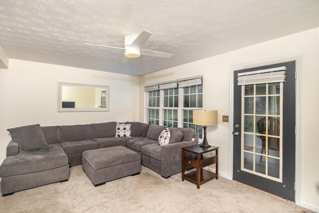 7638 Lake Pointe, Hamilton Twp, OH 45039 - living room featuring carpet, a ceiling fan, and a textured ceiling