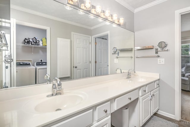 7638 Lake Pointe, Hamilton Twp, OH 45039 - full bath with double vanity, washing machine and clothes dryer, crown molding, baseboards, and wood finished floors