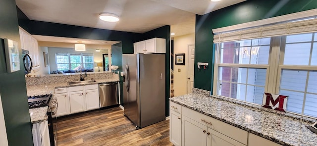 7638 Lake Pointe, Hamilton Twp, OH 45039 - kitchen featuring stainless steel appliances, dark wood-style flooring, a sink, and white cabinets