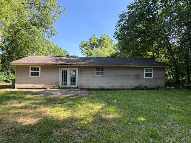 2307 Wilshire Cir, Stonelick Twp, OH 45122 - back of property featuring french doors, a yard, and a patio area