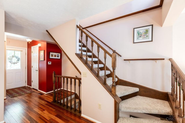 1627 Braintree Dr, Anderson Twp, OH 45255 - stairs featuring wood-type flooring and baseboards