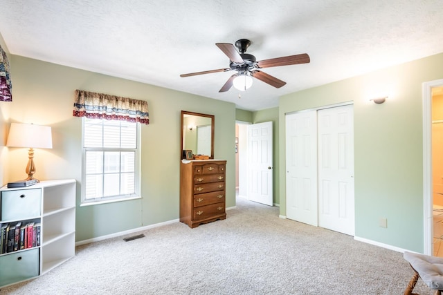 1627 Braintree Dr, Anderson Twp, OH 45255 - carpeted bedroom with baseboards, a closet, connected bathroom, and a ceiling fan