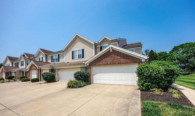 9298 Greenery Ct, Deerfield Twp, OH 45140 - view of property featuring concrete driveway and brick siding