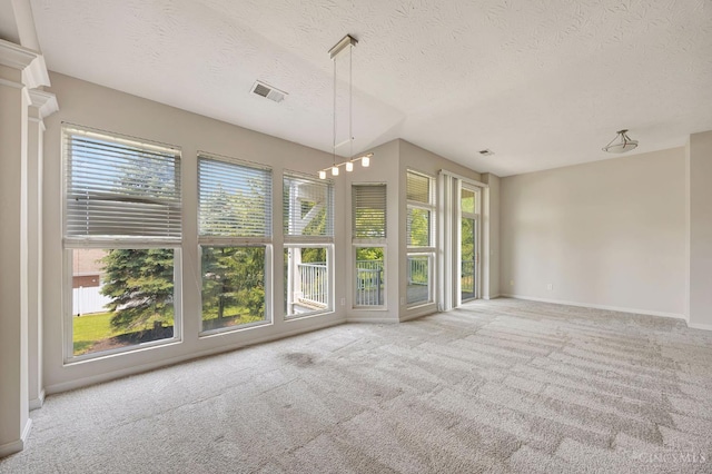 9298 Greenery Ct, Deerfield Twp, OH 45140 - carpeted empty room featuring plenty of natural light, a textured ceiling, and baseboards