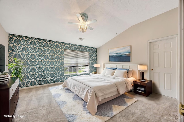 9298 Greenery Ct, Deerfield Twp, OH 45140 - carpeted bedroom featuring wallpapered walls, vaulted ceiling, a ceiling fan, baseboards, and an accent wall