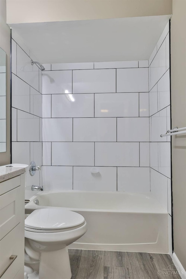 715 Castlegate Ln Unit 102, Springfield Twp, OH 45231 - bathroom with shower / washtub combination, toilet, vanity, and wood finished floors