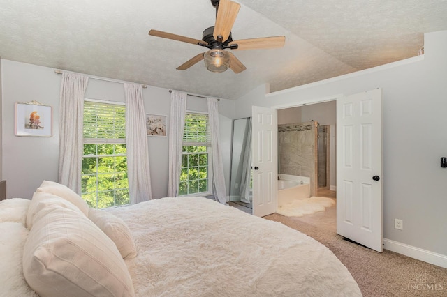 1732 Emerald Glade Ln Unit 6D, Anderson Twp, OH 45255 - bedroom with light carpet, baseboards, a textured ceiling, vaulted ceiling, and ensuite bath