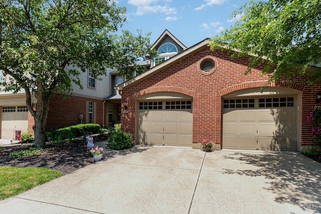 1732 Emerald Glade Ln Unit 6D, Anderson Twp, OH 45255 - view of front of home featuring brick siding and driveway
