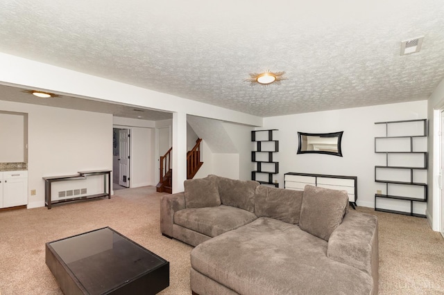 1732 Emerald Glade Ln Unit 6D, Anderson Twp, OH 45255 - living room featuring light carpet, stairway, a textured ceiling, and baseboards