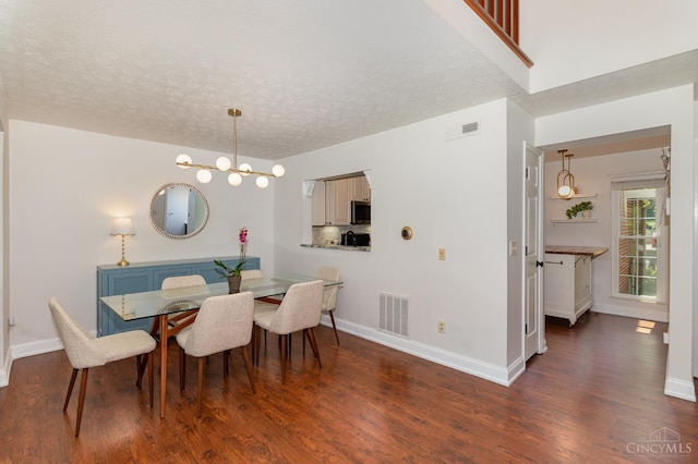 1732 Emerald Glade Ln Unit 6D, Anderson Twp, OH 45255 - dining space featuring wood finished floors, baseboards, and a textured ceiling
