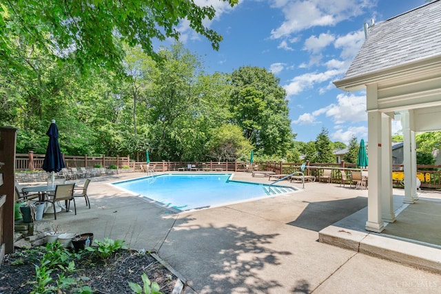 1732 Emerald Glade Ln Unit 6D, Anderson Twp, OH 45255 - community pool featuring a patio and view of wooded area