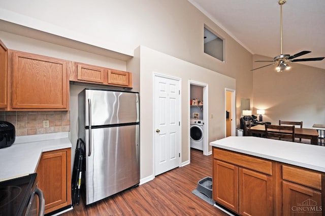557 Hamblin Dr, Union Twp, OH 45255 - kitchen with freestanding refrigerator, ceiling fan, light countertops, washer / dryer, and high vaulted ceiling