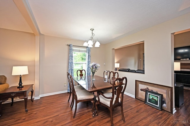 557 Hamblin Dr, Union Twp, OH 45255 - dining space with a chandelier, dark wood-style flooring, and baseboards