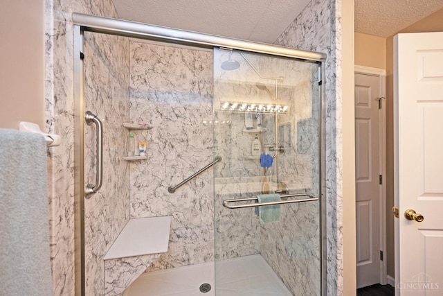 557 Hamblin Dr, Union Twp, OH 45255 - full bathroom featuring a textured ceiling and a stall shower