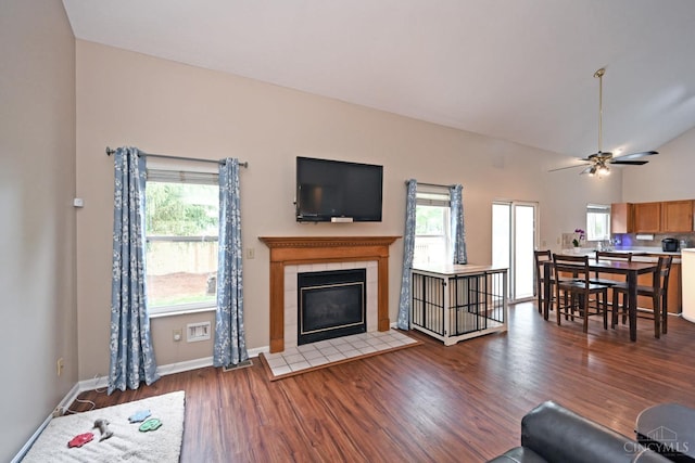 557 Hamblin Dr, Union Twp, OH 45255 - living area featuring wood finished floors, a tile fireplace, plenty of natural light, ceiling fan, and lofted ceiling