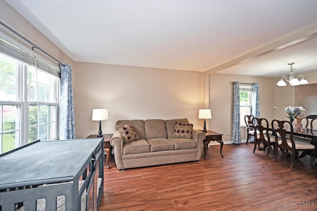 557 Hamblin Dr, Union Twp, OH 45255 - living area featuring wood finished floors, a chandelier, and baseboards
