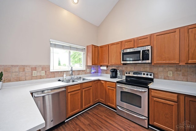 557 Hamblin Dr, Union Twp, OH 45255 - kitchen featuring stainless steel appliances, a sink, decorative backsplash, light countertops, and brown cabinetry