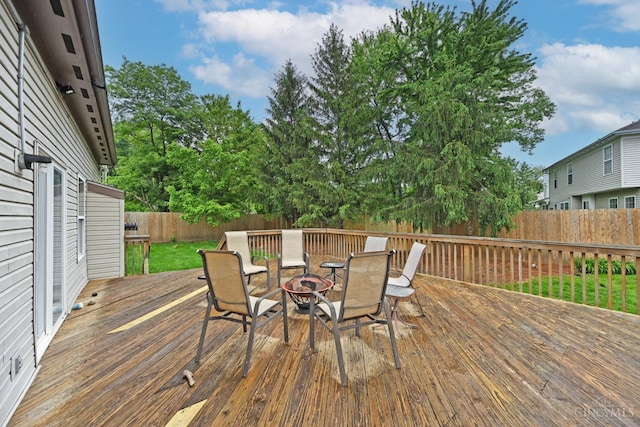 557 Hamblin Dr, Union Twp, OH 45255 - wooden deck featuring an outdoor fire pit and a fenced backyard
