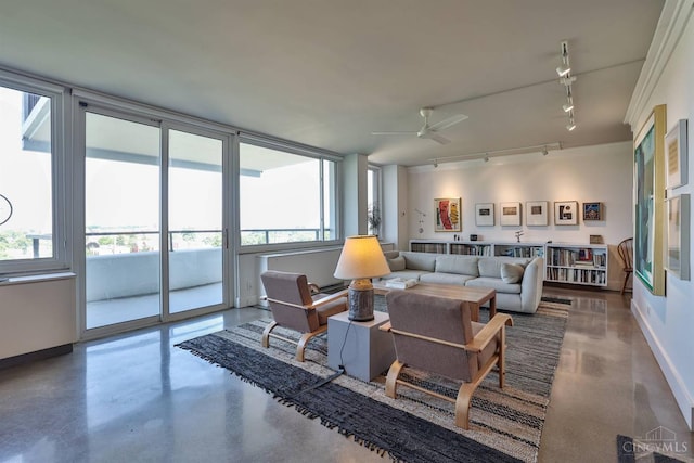 2401 Ingleside Ave Unit 10D, Cincinnati, OH 45206 - living room with rail lighting, finished concrete flooring, healthy amount of natural light, and a ceiling fan