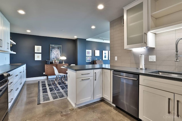 2401 Ingleside Ave Unit 10D, Cincinnati, OH 45206 - kitchen featuring stainless steel dishwasher, a peninsula, a sink, dark countertops, and concrete flooring