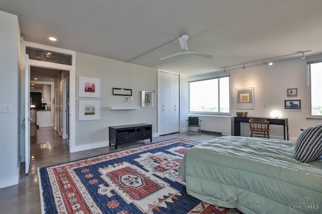 2401 Ingleside Ave Unit 10D, Cincinnati, OH 45206 - bedroom with multiple windows, rail lighting, baseboards, and ceiling fan