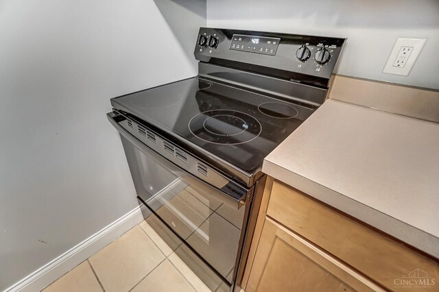 2110 Fulton Ave Unit 3, Cincinnati, OH 45206 - kitchen featuring range with electric cooktop and light tile patterned flooring