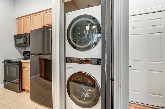2110 Fulton Ave Unit 3, Cincinnati, OH 45206 - laundry room with stacked washer / drying machine and light tile patterned floors