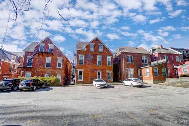 2110 Fulton Ave Unit 3, Cincinnati, OH 45206 - view of front of home with uncovered parking and brick siding