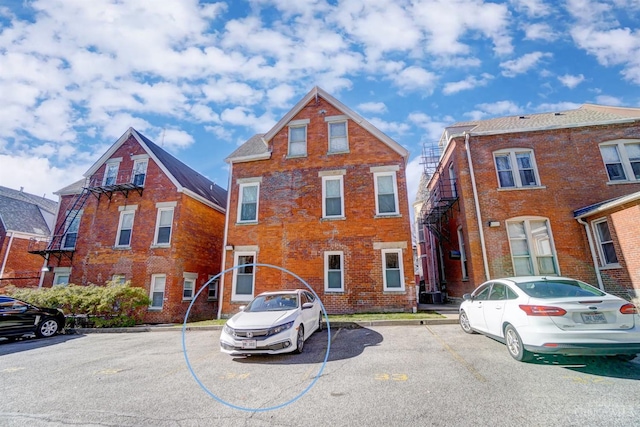 2110 Fulton Ave Unit 3, Cincinnati, OH 45206 - view of property with uncovered parking and brick siding
