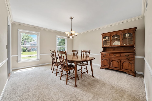 8912 Chapelsquare Ln, Symmes Twp, OH 45249 - dining space with a chandelier, light colored carpet, ornamental molding, and baseboards