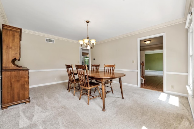 8912 Chapelsquare Ln, Symmes Twp, OH 45249 - dining space with carpet flooring, a chandelier, ornamental molding, and baseboards