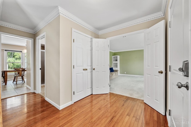 8912 Chapelsquare Ln, Symmes Twp, OH 45249 - hall with light wood-style floors, baseboards, ornamental molding, and an office area