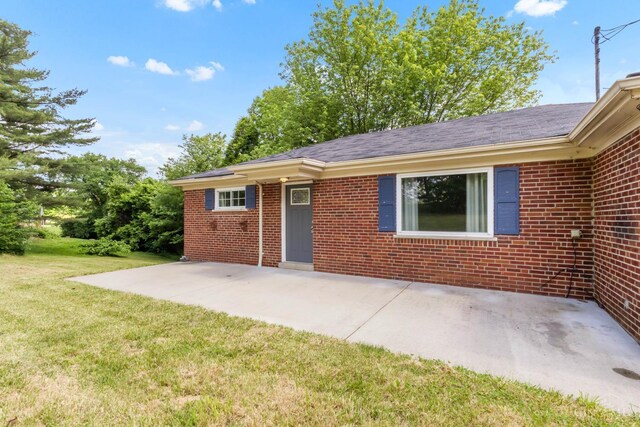 5386 Day Rd, Colerain Twp, OH 45251 - view of front facade featuring a patio area, a front lawn, and brick siding