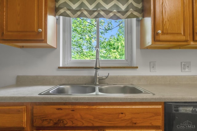 5386 Day Rd, Colerain Twp, OH 45251 - kitchen with a sink, dishwasher, light countertops, and brown cabinets