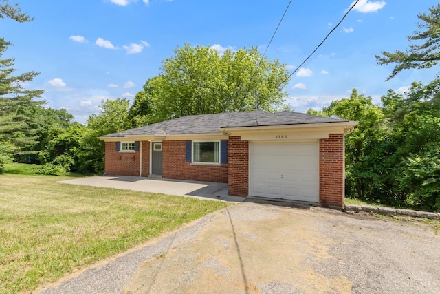 5386 Day Rd, Colerain Twp, OH 45251 - single story home featuring driveway, a front yard, an attached garage, and brick siding
