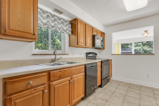 5386 Day Rd, Colerain Twp, OH 45251 - kitchen featuring black appliances, a sink, light countertops, and healthy amount of natural light