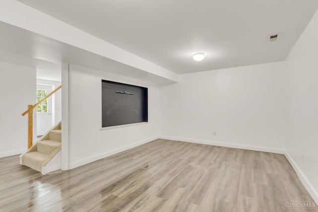 5386 Day Rd, Colerain Twp, OH 45251 - below grade area with light wood finished floors, stairs, and baseboards
