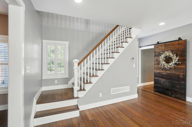 5757 W Fork Rd, Green Twp, OH 45247 - stairway with wood finished floors, recessed lighting, baseboards, and a barn door