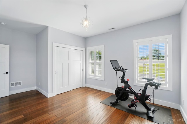 5757 W Fork Rd, Green Twp, OH 45247 - workout area featuring wood-type flooring, baseboards, and a chandelier