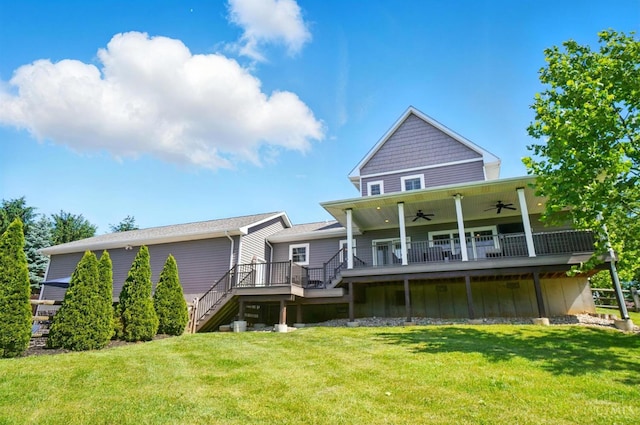 5757 W Fork Rd, Green Twp, OH 45247 - back of house featuring a ceiling fan, stairway, a deck, a yard, and board and batten siding