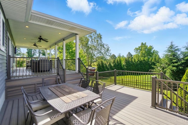 5757 W Fork Rd, Green Twp, OH 45247 - wooden deck with outdoor dining area, ceiling fan, a lawn, and view of wooded area