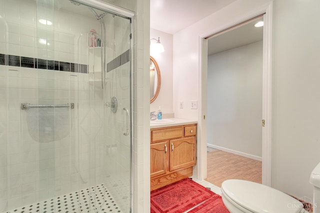 3169 John Gray Rd, Colerain Twp, OH 45251 - full bathroom with toilet, a stall shower, vanity, and wood finished floors