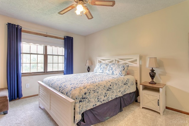 3169 John Gray Rd, Colerain Twp, OH 45251 - bedroom with light colored carpet, a textured ceiling, baseboards, and ceiling fan