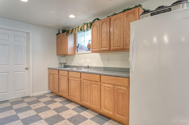 3169 John Gray Rd, Colerain Twp, OH 45251 - kitchen featuring freestanding refrigerator, light floors, recessed lighting, a sink, and baseboards