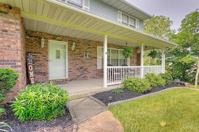 3169 John Gray Rd, Colerain Twp, OH 45251 - doorway to property with a porch and brick siding