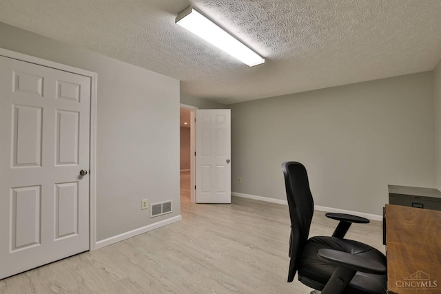 8750 E Kemper Rd, Symmes Twp, OH 45249 - office space with a textured ceiling, wood finished floors, and baseboards