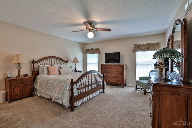 8750 E Kemper Rd, Symmes Twp, OH 45249 - bedroom featuring multiple windows, light carpet, and ceiling fan