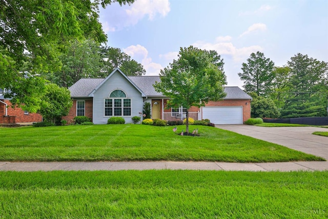 8750 E Kemper Rd, Symmes Twp, OH 45249 - view of front of house featuring concrete driveway, an attached garage, brick siding, and a front yard
