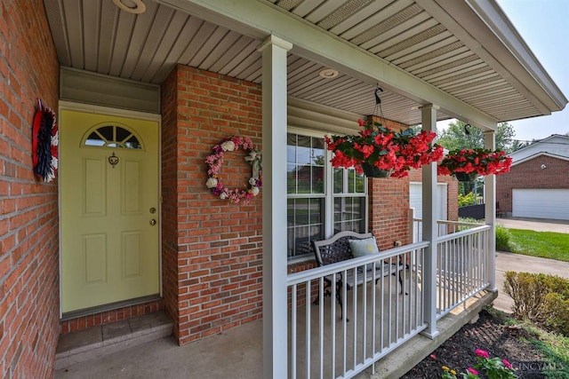 8750 E Kemper Rd, Symmes Twp, OH 45249 - view of exterior entry featuring covered porch and brick siding