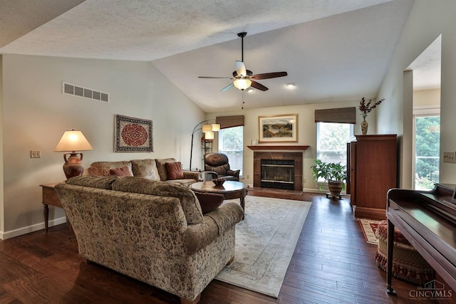 8750 E Kemper Rd, Symmes Twp, OH 45249 - living room with vaulted ceiling, a ceiling fan, a fireplace, dark wood-type flooring, and baseboards